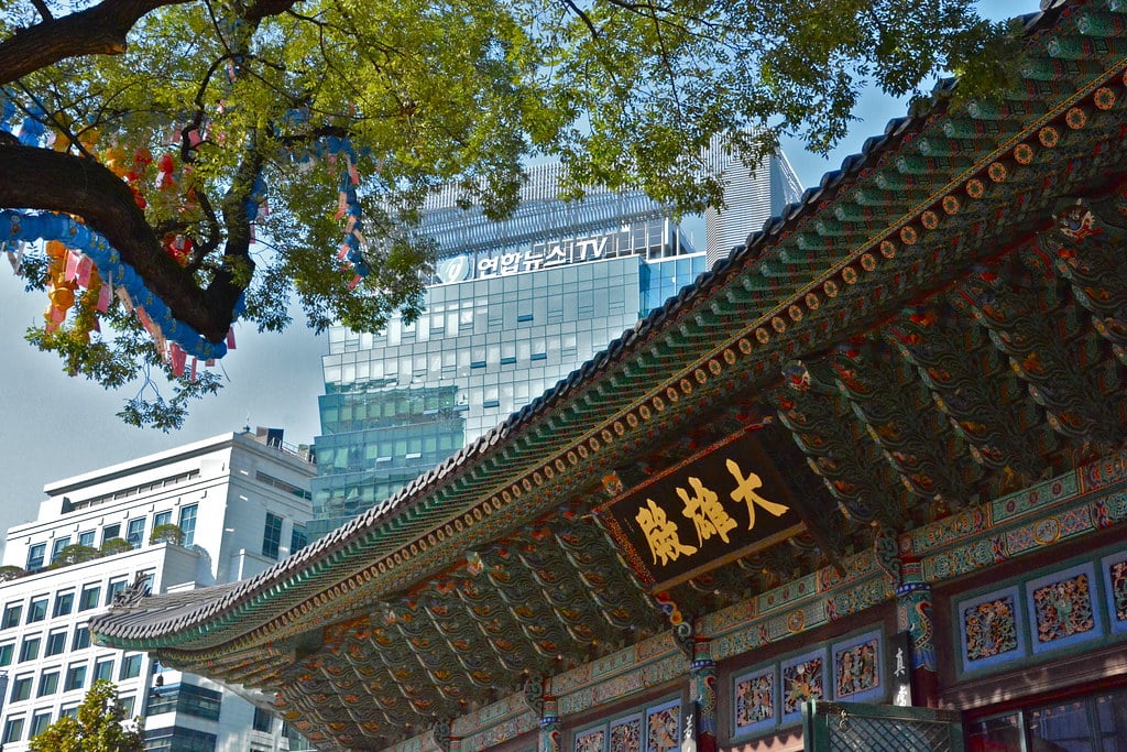 Palace gate against city buildings